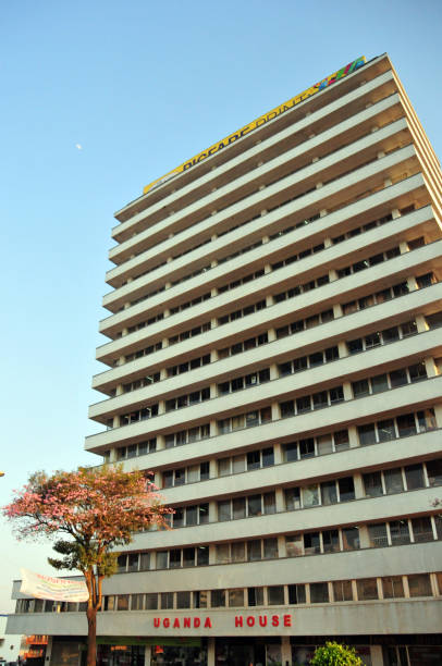 Kampala, Uganda: Uganda House / UPC House, Uganda People's Congress, a political party in Uganda. The UPC was founded in 1960 by Milton Obote, who led the country to independence and later served two presidential terms. The 16t floor tower was completed in 1980 by Idi Amin, it is owned and operated by the Milton Obote Foundation and houses the UPC headquarters. Kampala road. Architects: Peatfield and Bodgener.